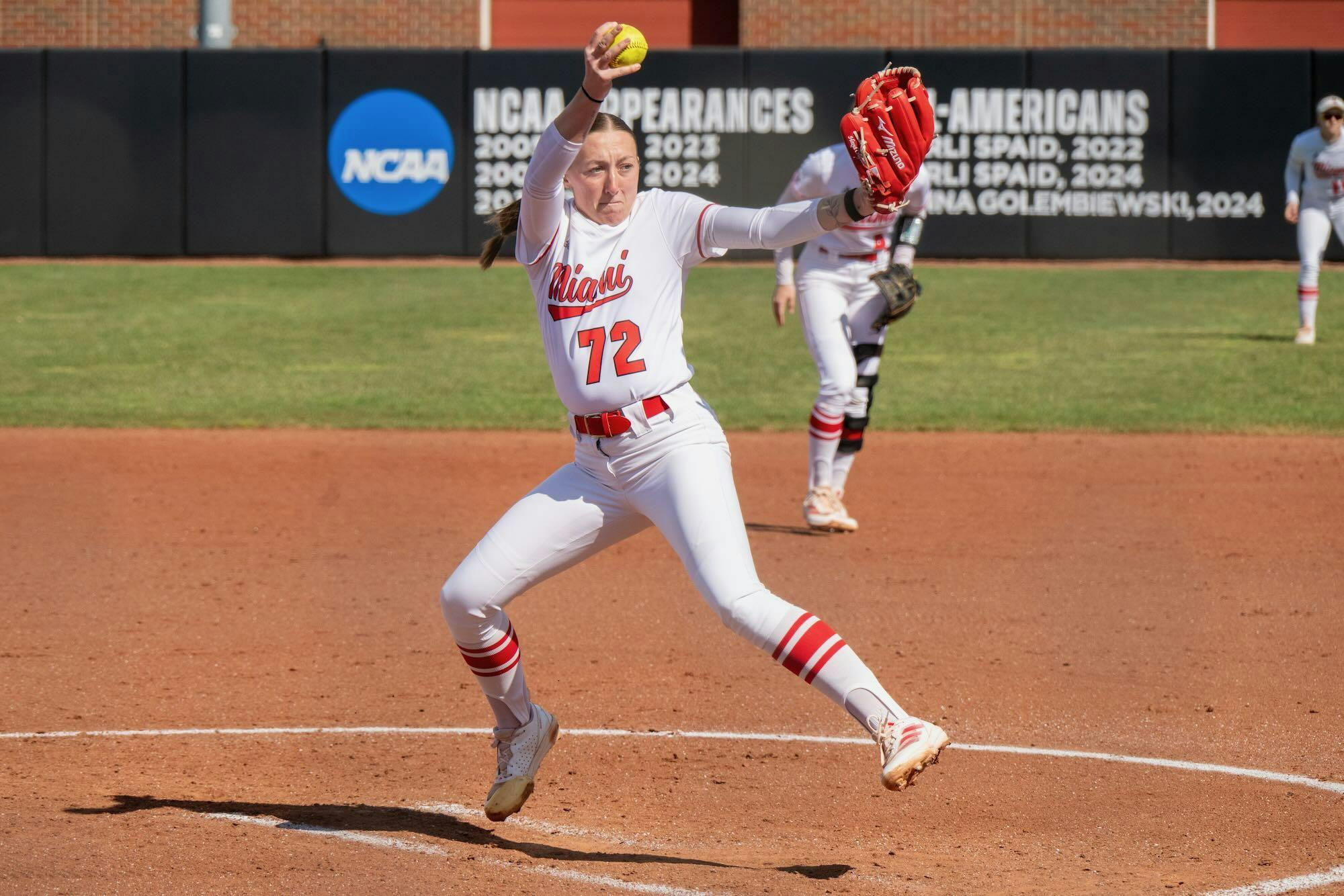 Madilyn Reeves winds up her pitch against the Northern Illinois University Huskies at Miami Softball Stadium on March 21