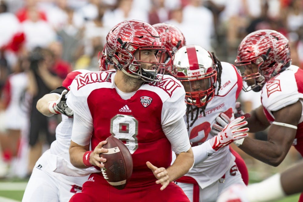 An under-pressure Drew Kummer scans the field for an open target.