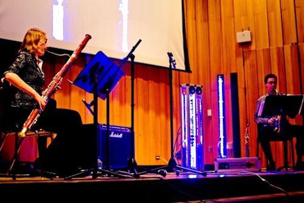 Dana Jessen and Michael Strauss, members of the Electro Acoustic Reed Duo, performed alongside a robitically plucked guitar chord and an electronic clarinet.