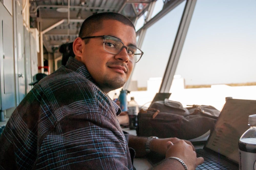 Kethan Babu sits in the press box at Northern Illinois University for Miami’s football game on Oct. 4, 2025.