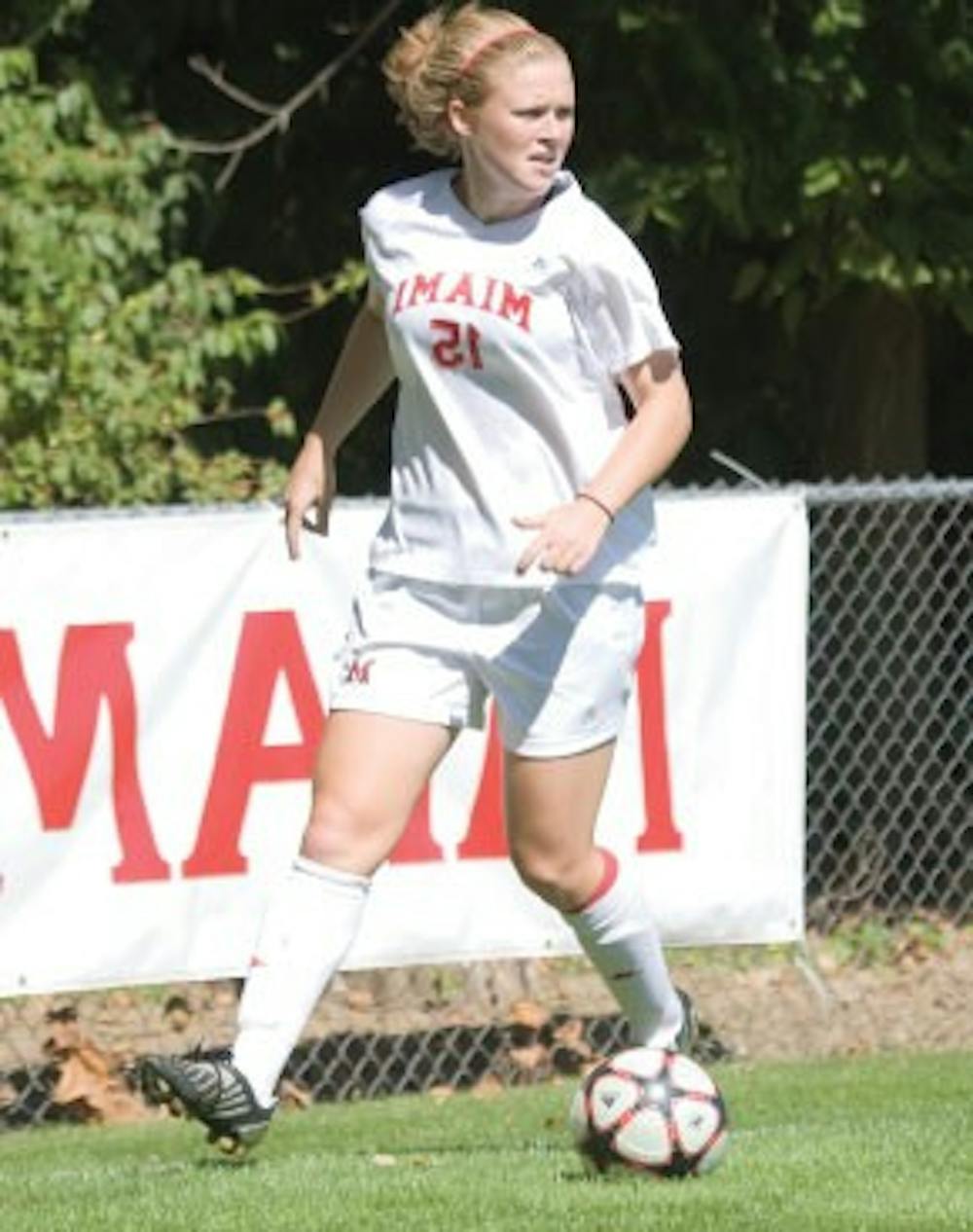 Junior Haley Clark eyes her next move in the ’Hawks’ game against Western Michigan Oct. 23, 2009.