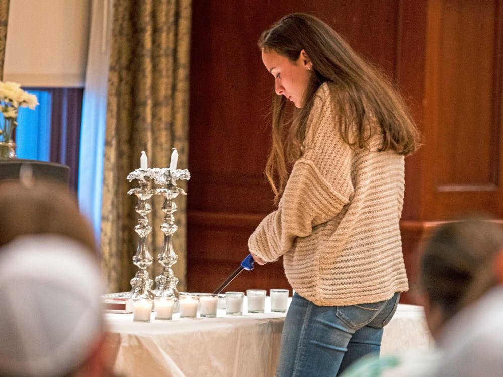 Students lit 11 candles for the victims of the Tree of Life shooting.