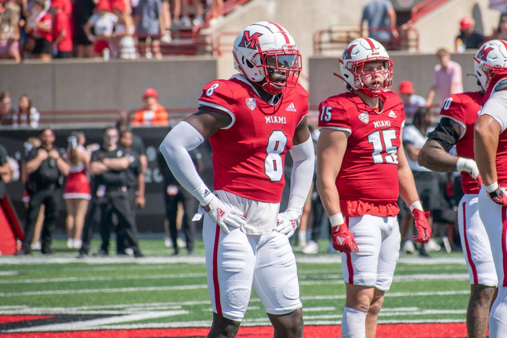 Brian Ugwu (No. 8) and Matt Salopek (No. 15) on the field against Cincinnati on Sept. 14