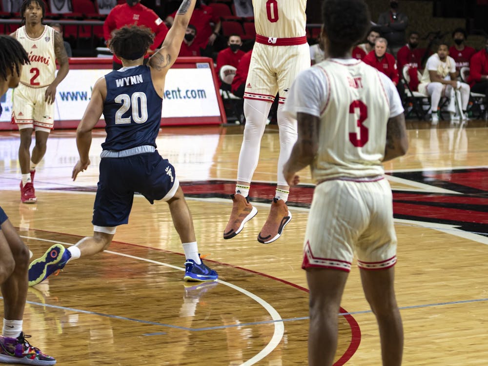 Redshirt freshman forward Javin Etzler attempts a 3-pointer in a Feb 12 loss to Akron