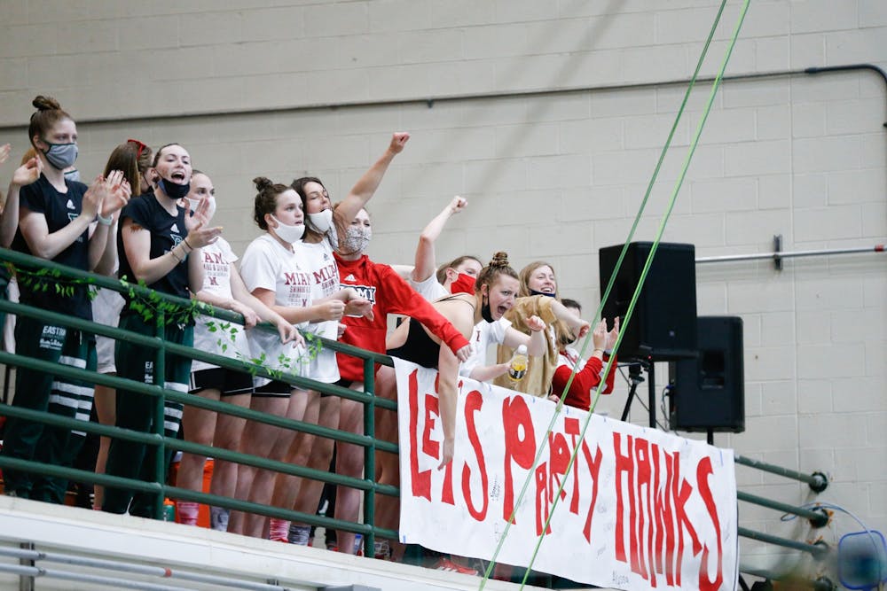 <p>RedHawk swimmers cheer on their teammates during last weekend&#x27;s MAC championship meet.</p>