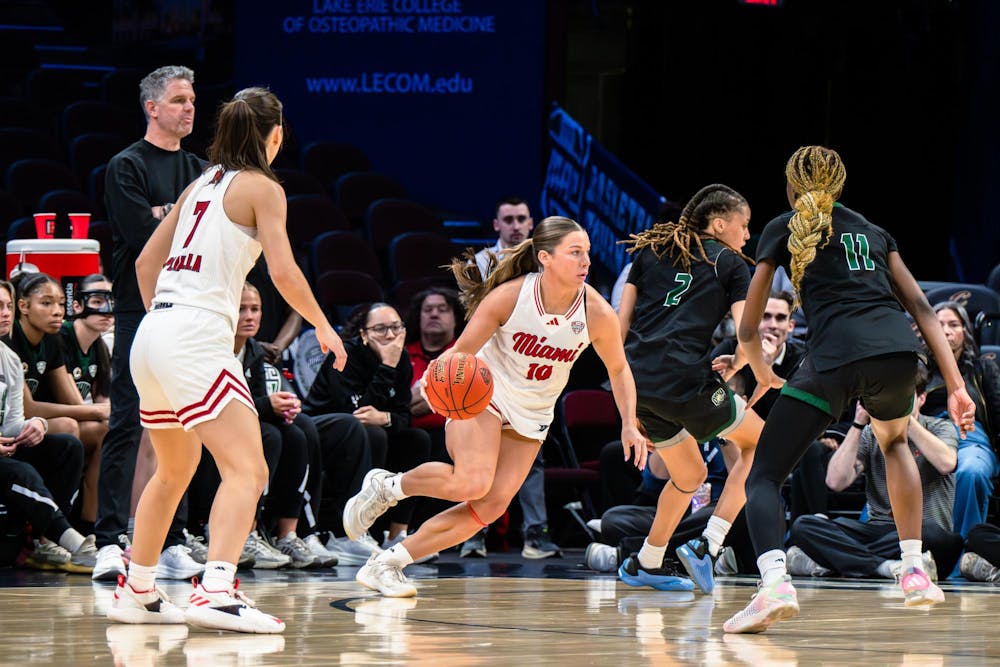 Redshirt junior guard Macie Taylor dribbles the ball in a game against Ohio University. 