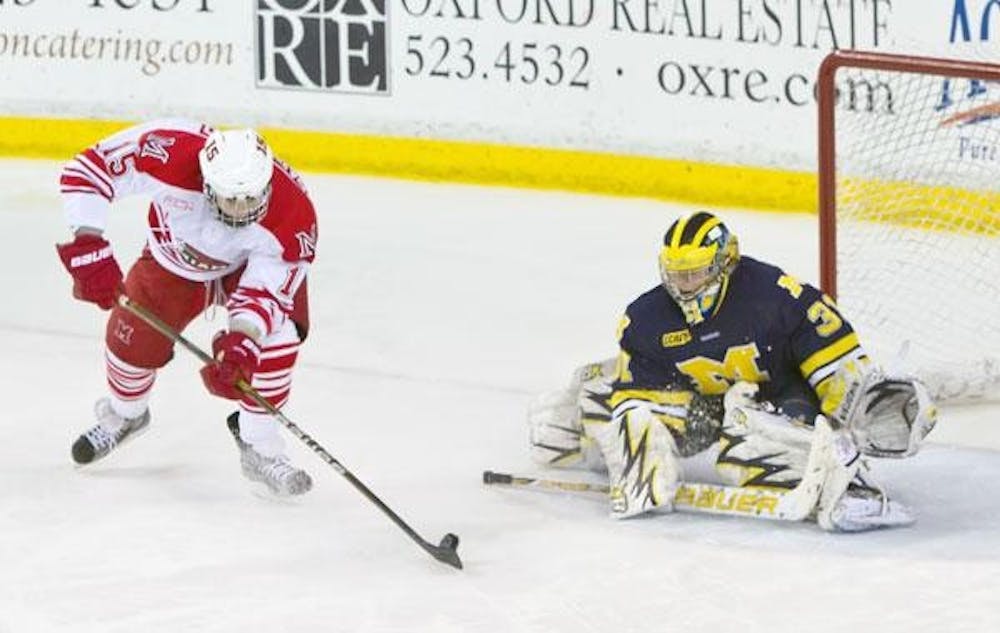 Sophomore Bryon Paulazzo prepares his shootout-winning goal against University of Michigan goalie Shawn Hunwick Saturday. Paulazzo skated to the right, cut back and faked a shot before firing a spinning backhander past Hunwick. Paulazzo’s shot won the game in the sudden death shootout. Saturday’s game was a draw, with Miami earning an extra point in the CCHA standings. With Friday’s win and Saturday’s draw, Miami extended their unbeaten streak against Michigan to five games.