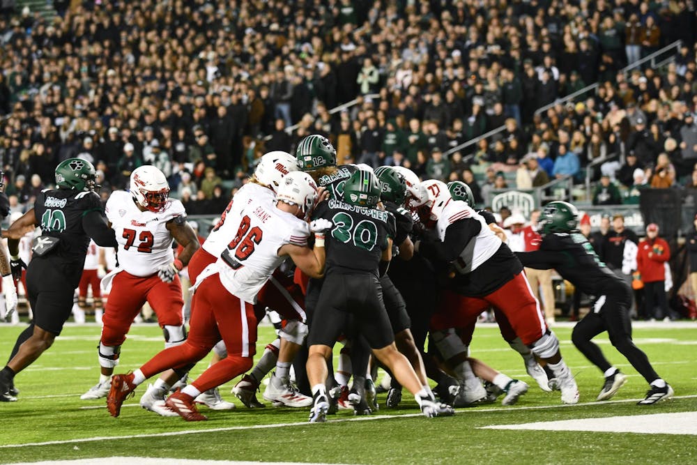 Miami's offense blocks against the OU's defensive line in the second quarter at Peden Stadium on Nov. 4