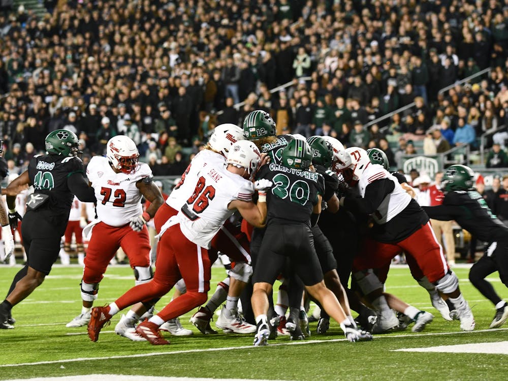 Miami's offense blocks against the OU's defensive line in the second quarter at Peden Stadium on Nov. 4