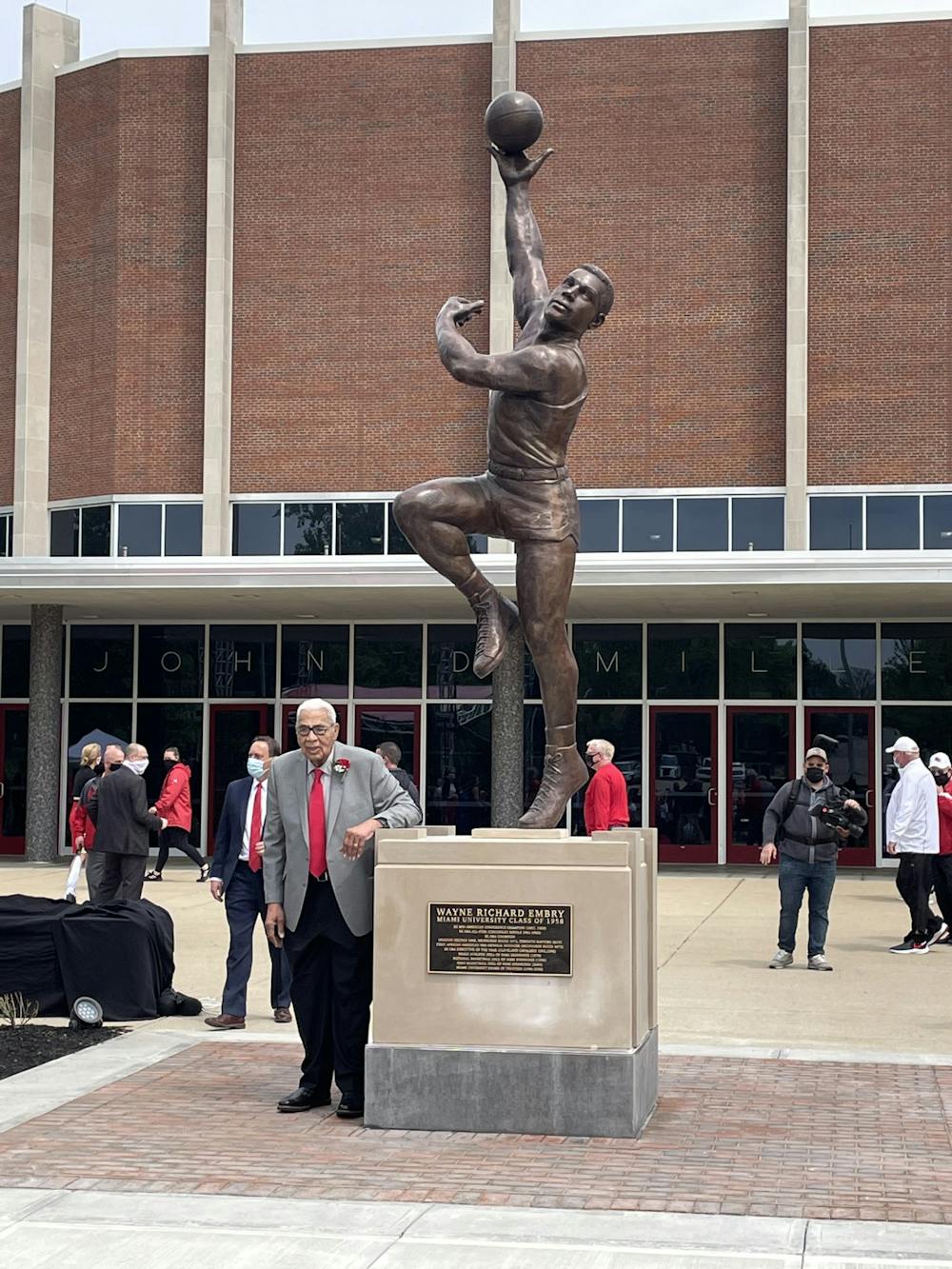 Wayne Embry with his new likeness in front of Millett Hall