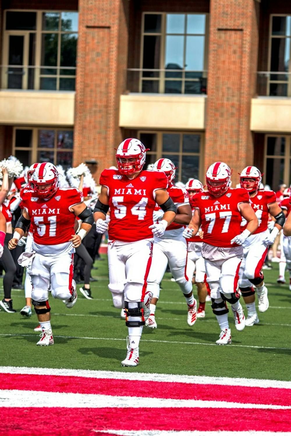 <p>Then-redshirt junior offensive lineman Tommy Doyle (No. 54) leads the RedHawks onto the Yager Stadium turf before Miami&#x27;s Sept. 28 showdown with Buffalo.</p>