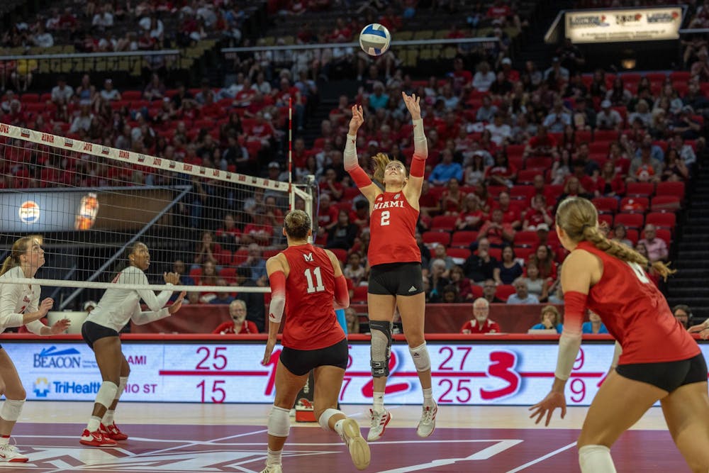 <p>Senior setter Hayden Hicks sets the ball to her teammate against Ohio State on Carolyn Condit Day on Sept. 3 at Millett Hall. </p>