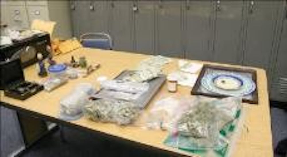 OPD displays Percocet, Adderall, marijuana, scales and money from recent drug busts.