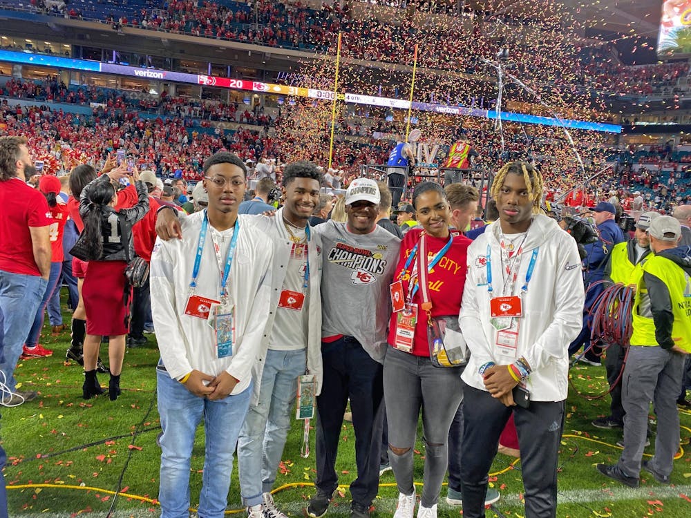 (From left to right) Daeh McCullough, Deland McCullough II, Deland McCullough, Darnell McCullough and Dasan McCullough take a family photo on the field after the Super Bowl.