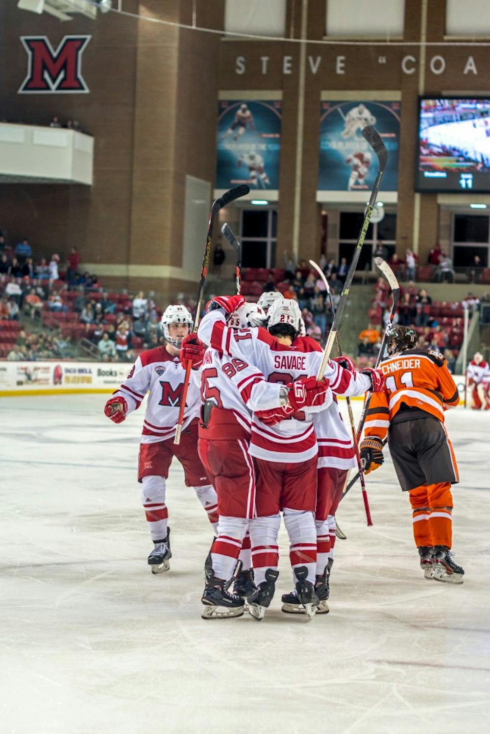 Five RedHawks celebrate against Bowling Green at the Goggin Ice Center Sunday. In his first year as head coach, Chris Bergeron is trying to create a new culture.