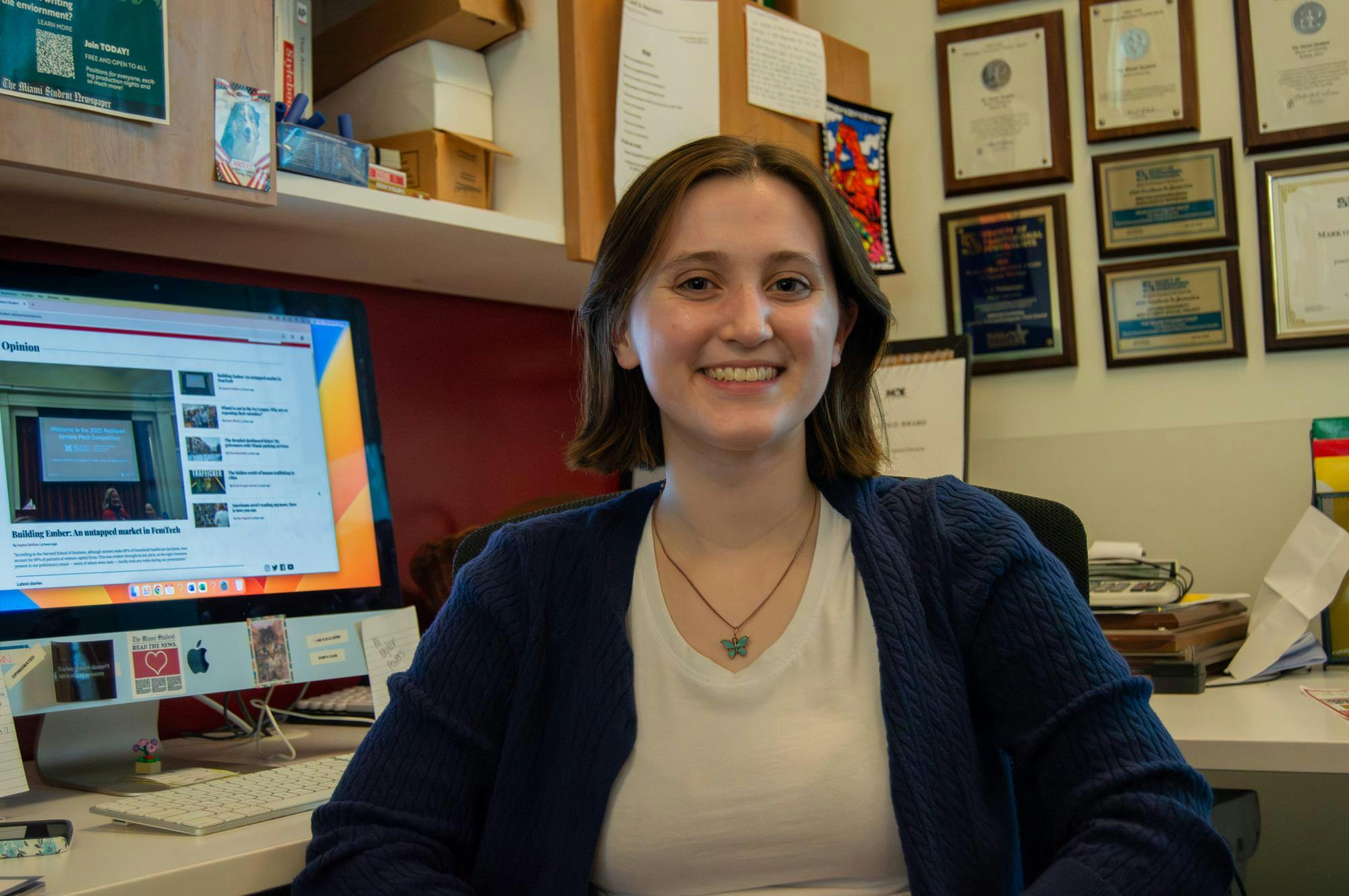 Taylor Powers, Opinion Editor, sits at her desk.