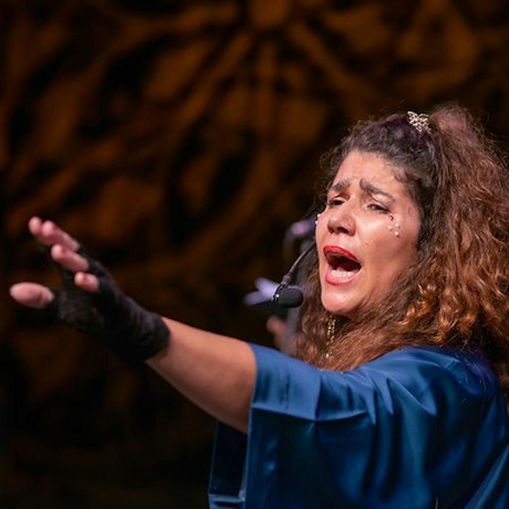 Paula Gândara, the singer/lyricist in Duo Rocha Gândara, sings at the show "On the Reflection of Time” during their Brazil tour in 2022