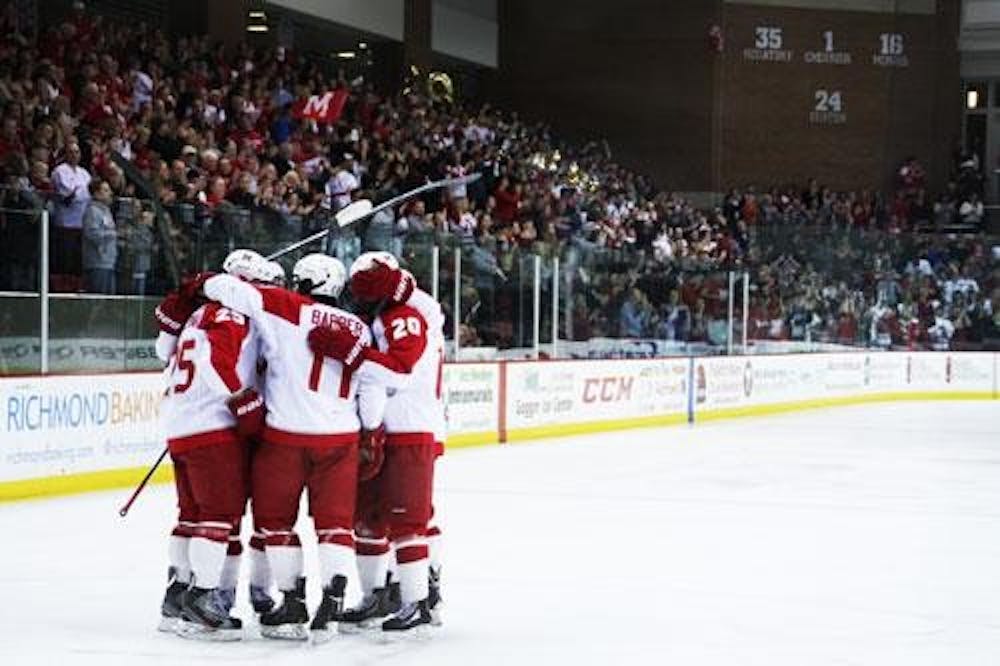 Miami forwards Riley Barber, Jimmy Mullin, Blake Coleman, Austin Czarnik and Alex Wideman celebrate Coleman’s power play goal during Miami’s 3-2 loss to Wisconsin Saturday. 