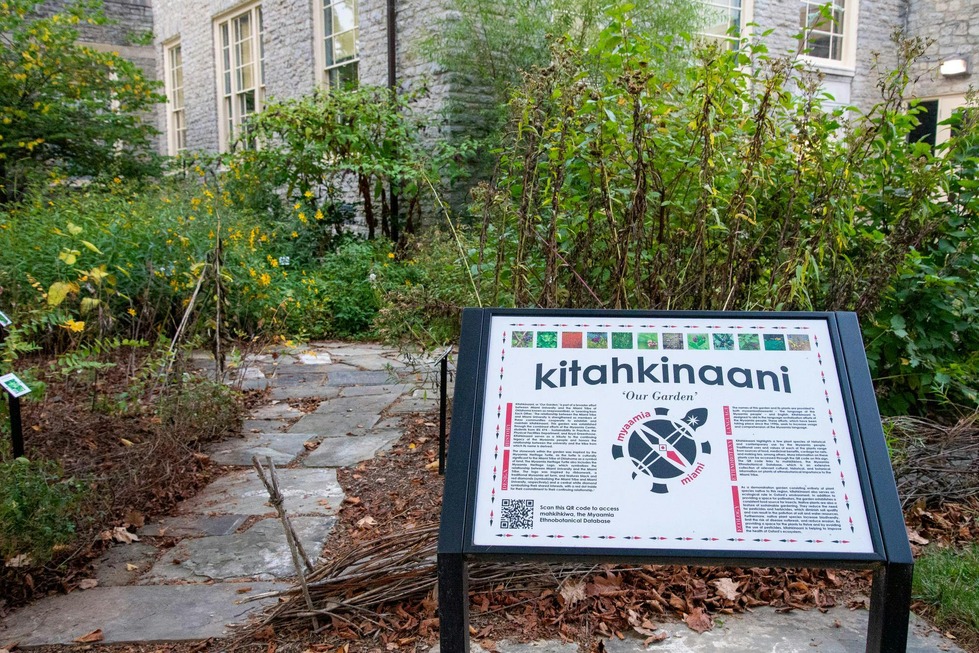 A sign welcomes visitors into Kitahkinaani or 'Our Garden' which is home to various plants native to the homelands of the Myaamia peoples.  