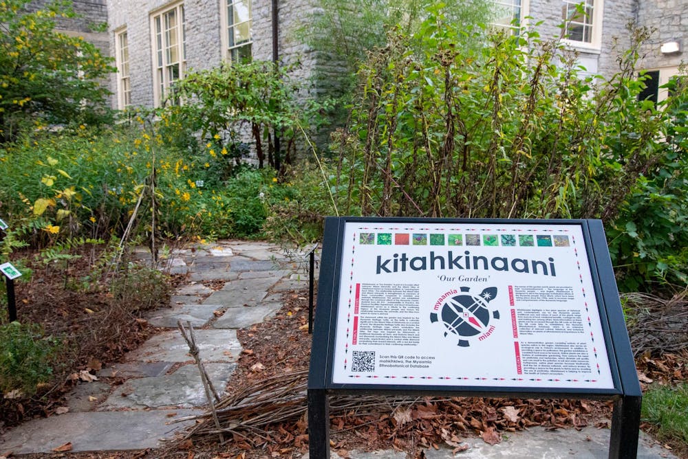 A sign welcomes visitors into Kitahkinaani or 'Our Garden' which is home to various plants native to the homelands of the Myaamia peoples.  