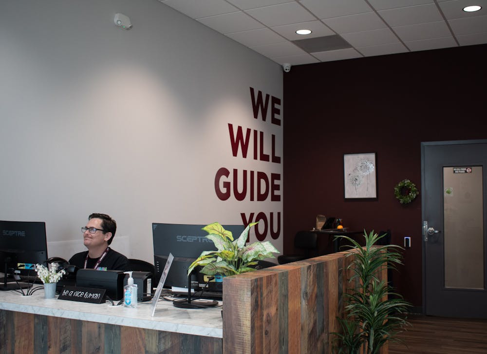 <p>The manager of Consume Oxford welcomes guests into the new store, located on Southpointe Pkwy.</p>