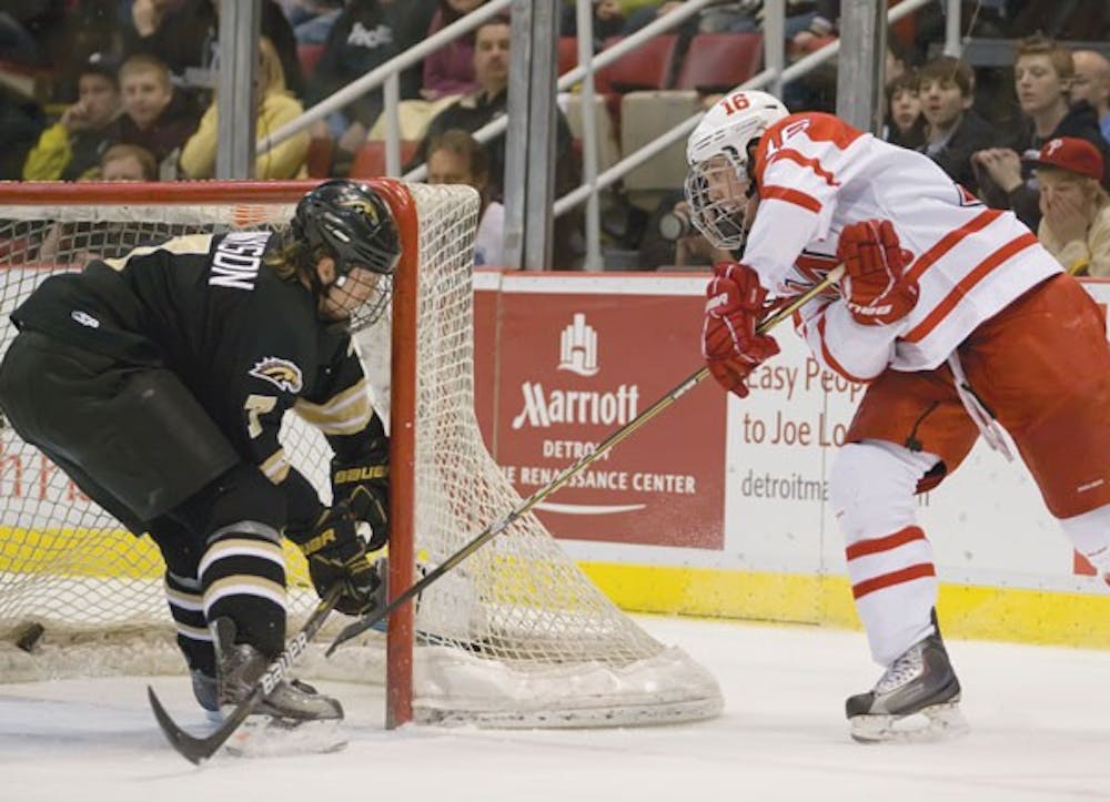 Sophomore Curtis McKenzie scores on a backhand attempt in Miami’s 5-2 win over Western Michigan University Saturday in the CCHA Championship game. 