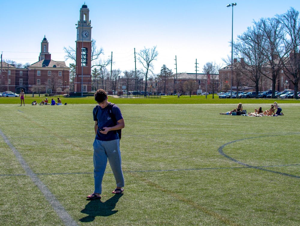 Students relax on Cook Field last spring semester, before the area was permanently closed.