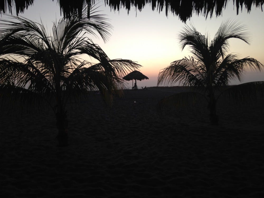 The sun setting over the beach after a long day.