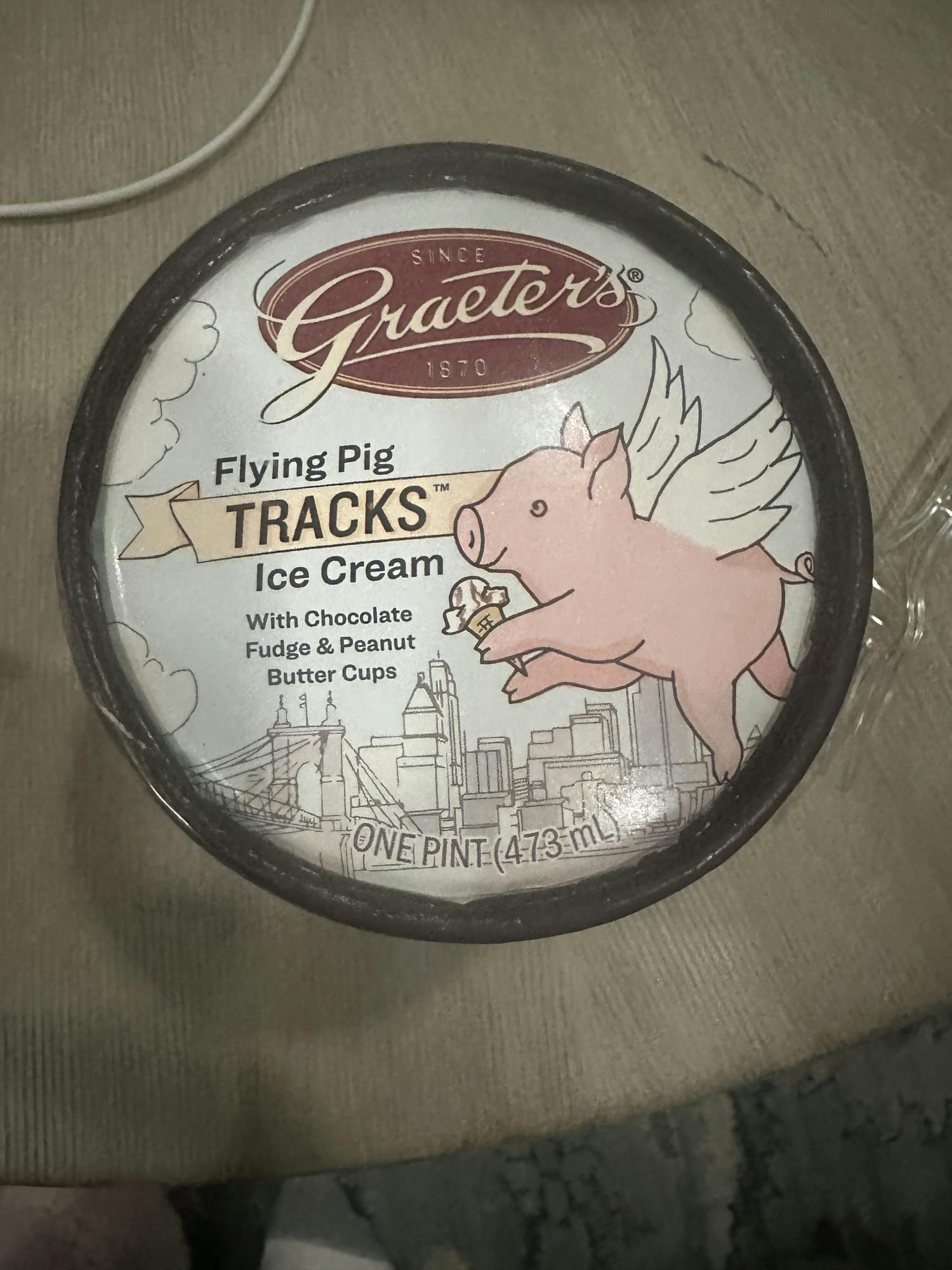 Graeters' "Flying Pig Tracks" flavor plays into Cincinnati's race theme with a design of a pig with wings on its' pint. 