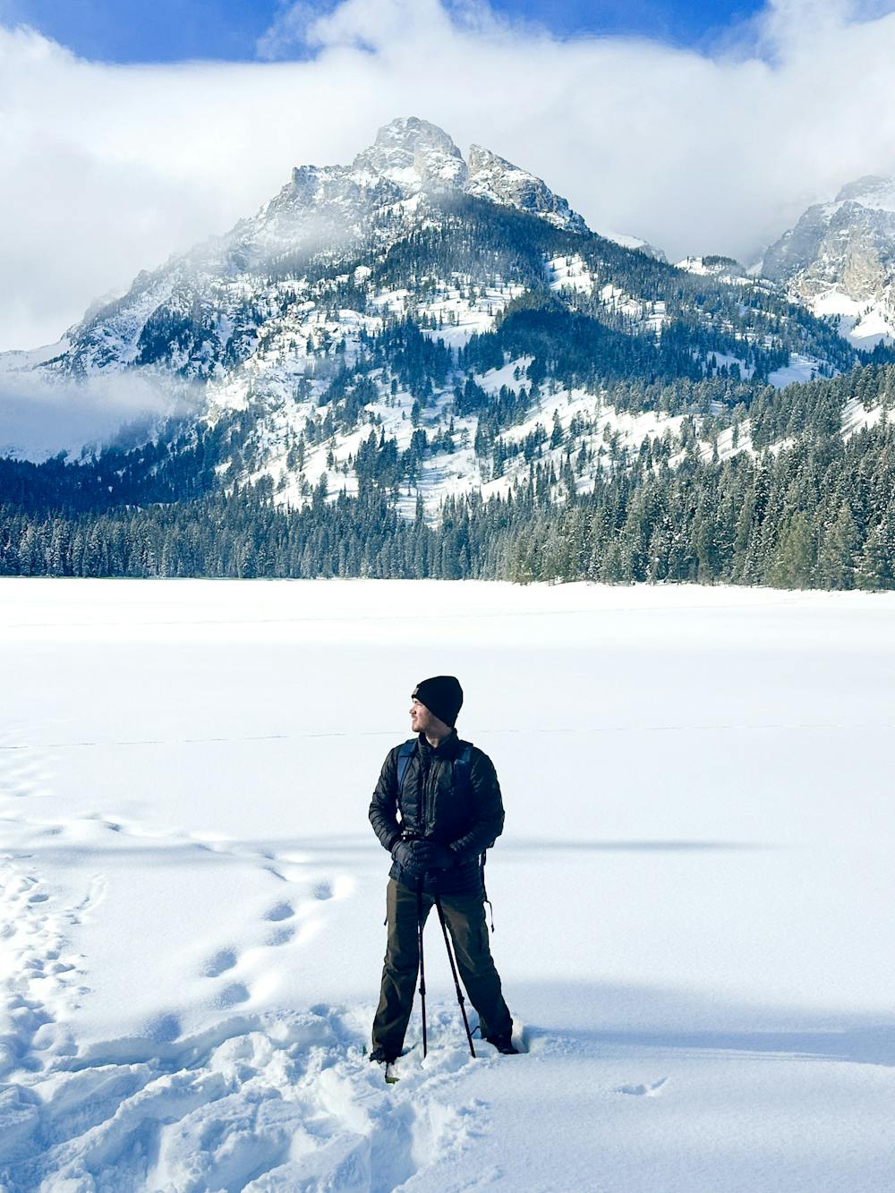 Author Sam Norton below a peak in the Teton mountain range.