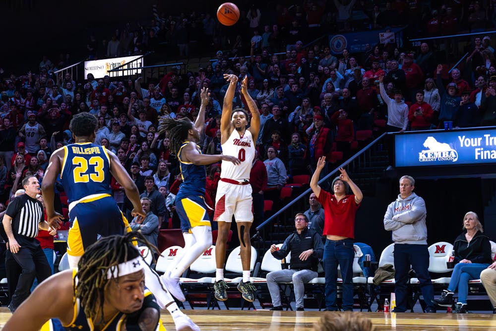 Sophomore wing Eian Elmer taking a deep shot against Kent State on Feb. 21 at Millett Hall