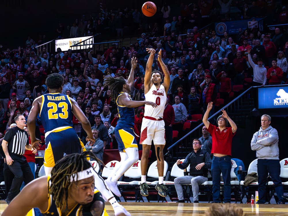 Sophomore wing Eian Elmer taking a deep shot against Kent State on Feb. 21 at Millett Hall