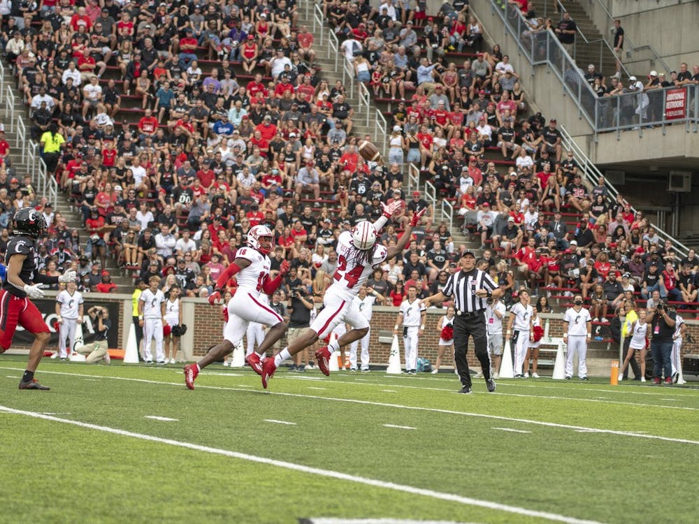 Junior defensive back Ja'don Rucker-Furlow stretches out for a potential interception in Miami's 49-14 loss to Cincinnati.
