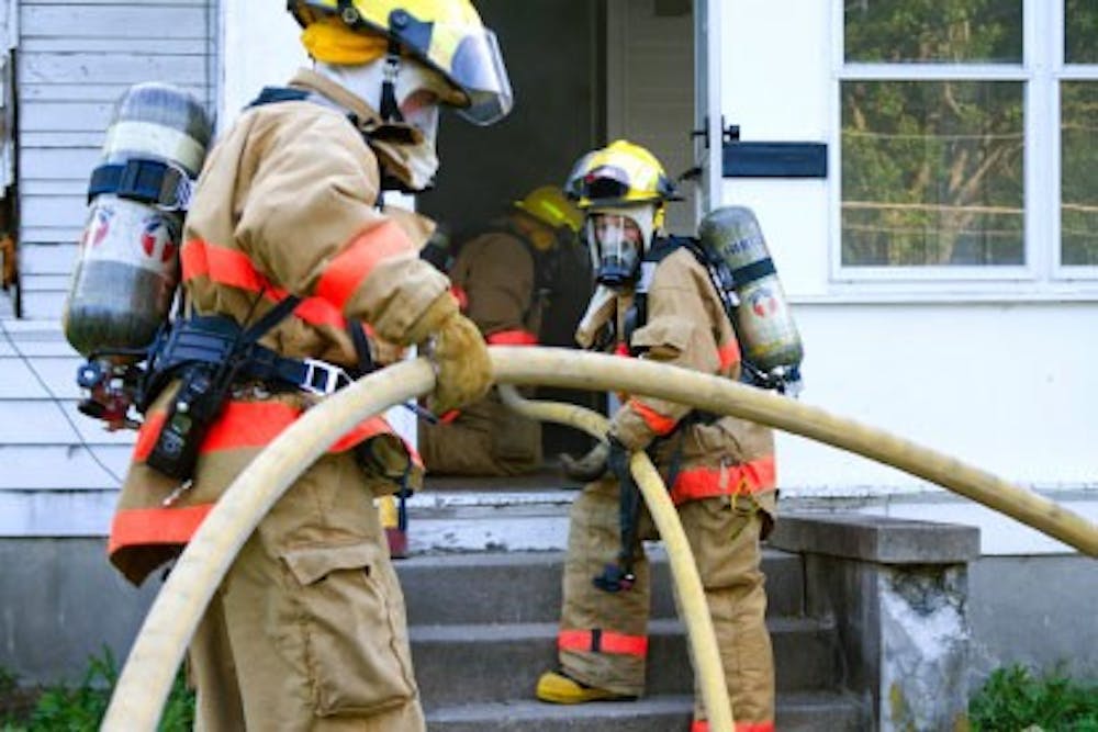 Oxford firefighters participate in a search and rescue training exercise May 24 in an unoccupied home on Main Street.
