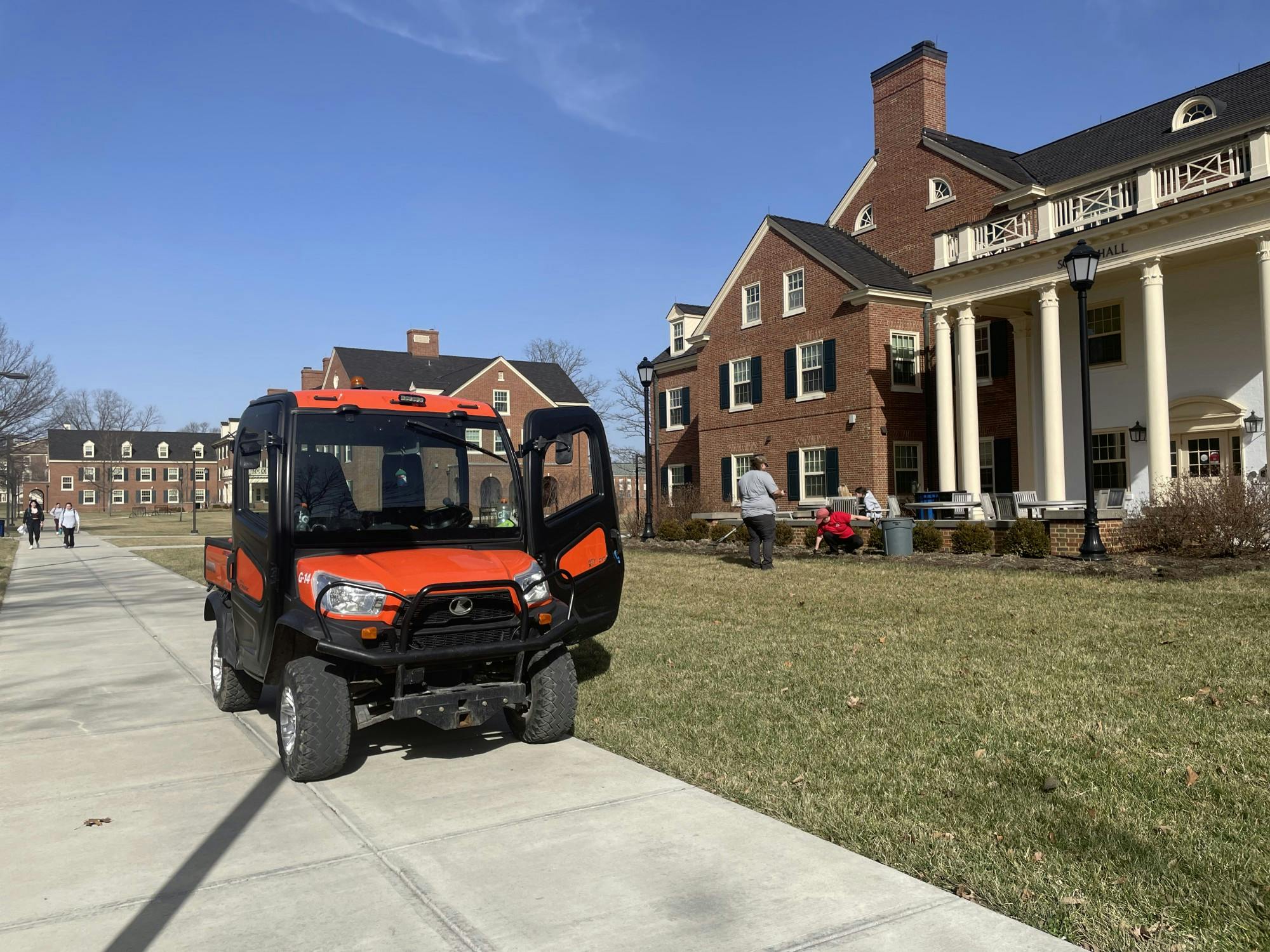 A Miami groundskeeper parks in ﻿front of a residence hall to clean the grass.