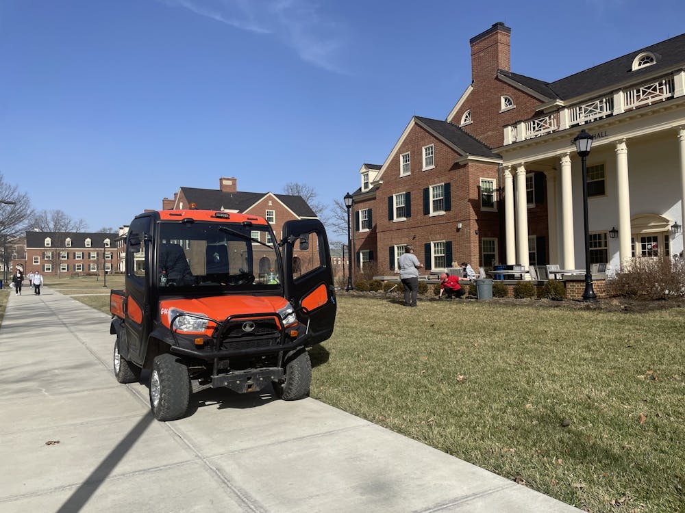 <p>A Miami groundskeeper parks in ﻿front of a residence hall to clean the grass.</p>