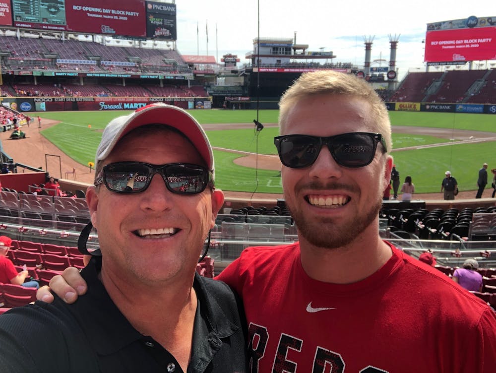 Todd (left) and Brady Pfister get ready to take in the final Cincinnati Reds home game of 2019.