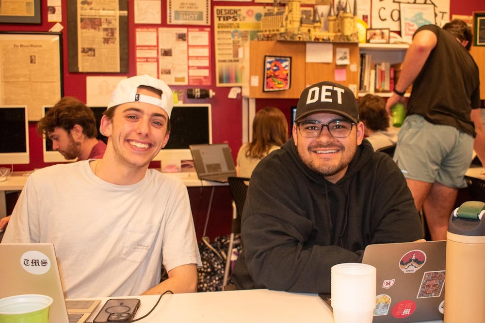 Jeffrey Middleton (left) and Kethan Babu (right) smile in The Miami Student’s newsroom.