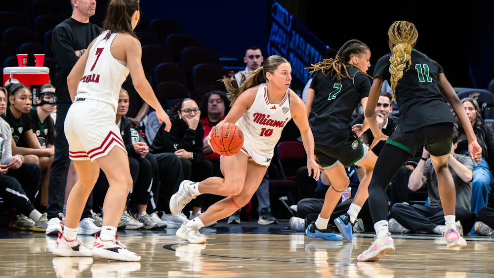 Macie Taylor dribbles the ball up the court in game 2 of the MAC Tournament against Ohio University.