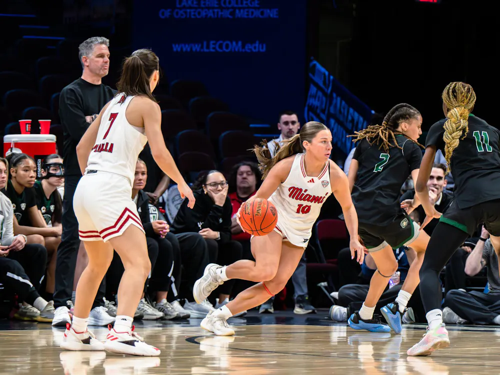 Macie Taylor dribbles the ball up the court in game 2 of the MAC Tournament against Ohio University.
