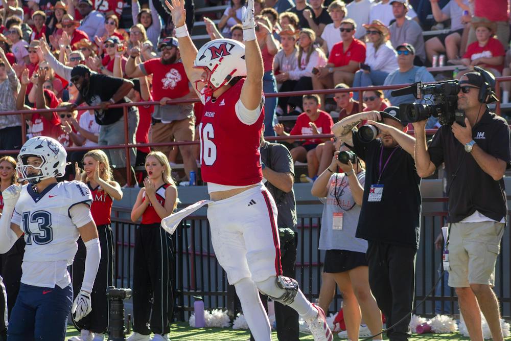 Redshirt-freshman quarterback David McComb celebrates in game against the University of Connecticut on Sept. 26.