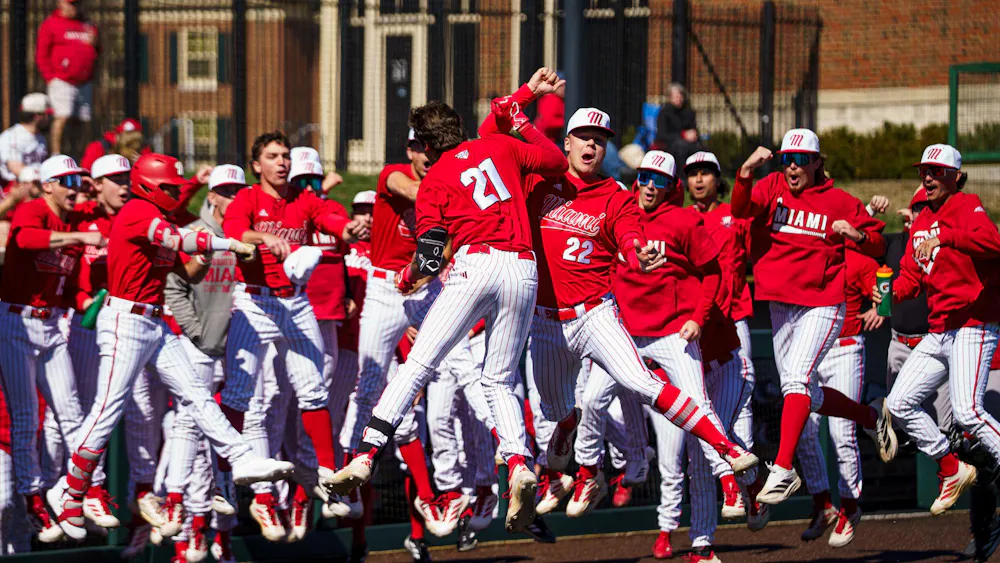 The Miami University RedHawks baseball team celebrates after a 9-4 victory over the Eastern Michigan Eagles on March 8