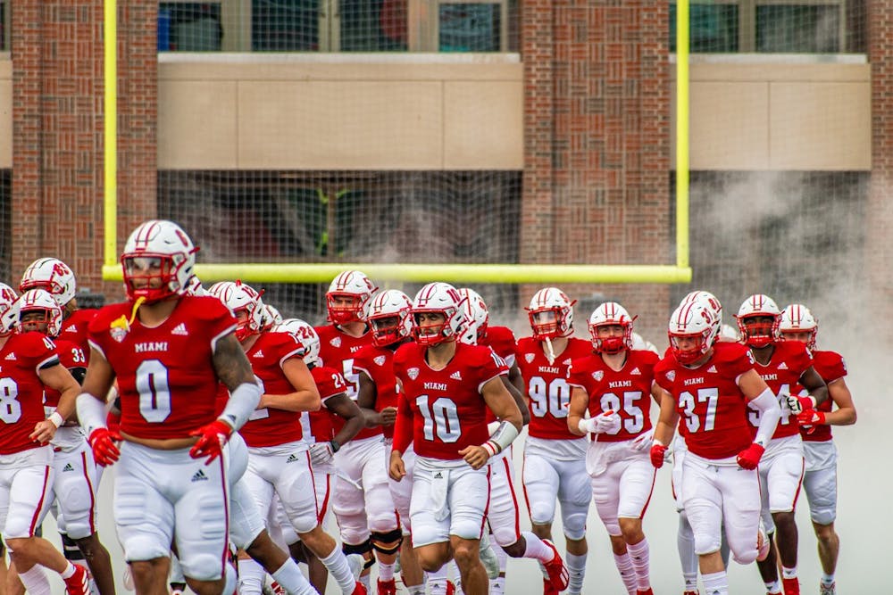 The Miami RedHawks run onto the field before an Oct. 2 matchup vs. Central Michigan University. The RedHawks beat Central Michigan 28-17.