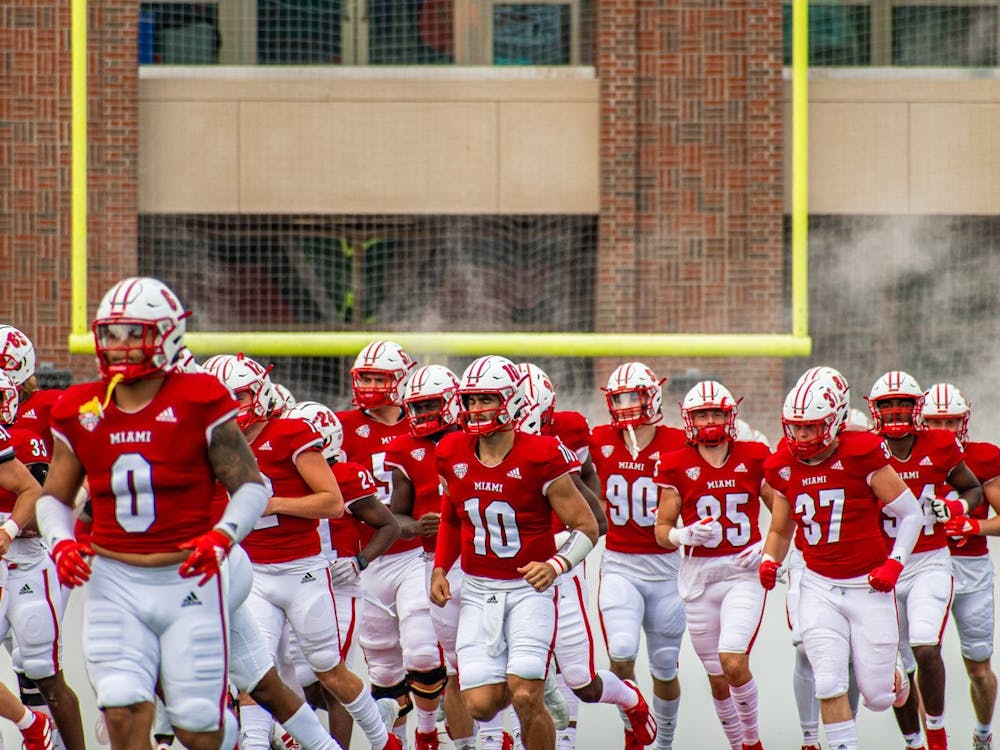 The Miami RedHawks run onto the field before an Oct. 2 matchup vs. Central Michigan University. The RedHawks beat Central Michigan 28-17.