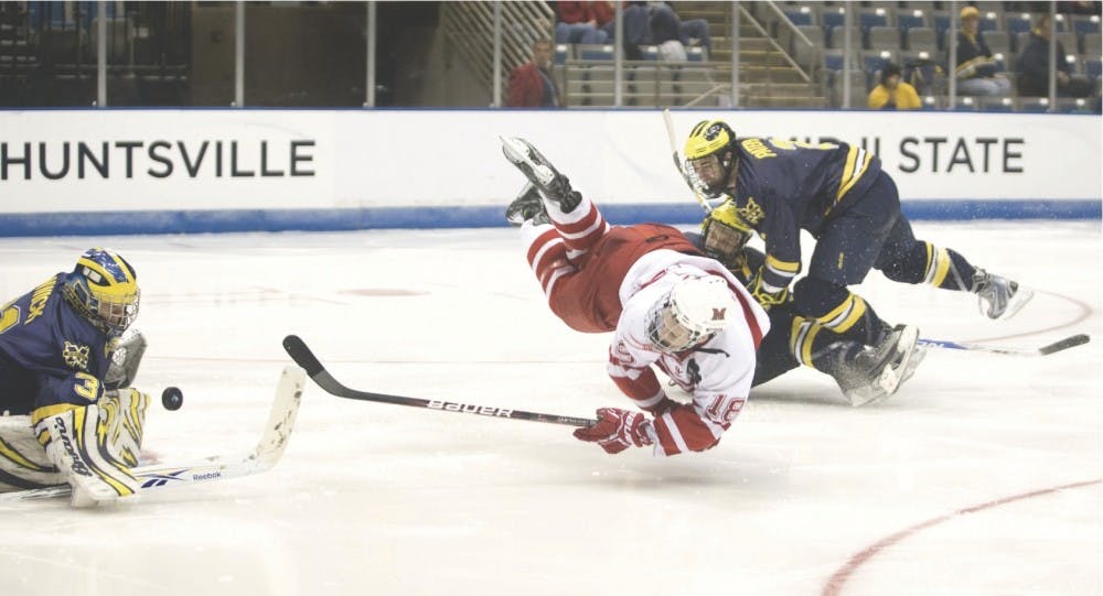 Freshman Reilly Smith defends the puck against the University of Michigan in the NCAA Regional Final March 28.