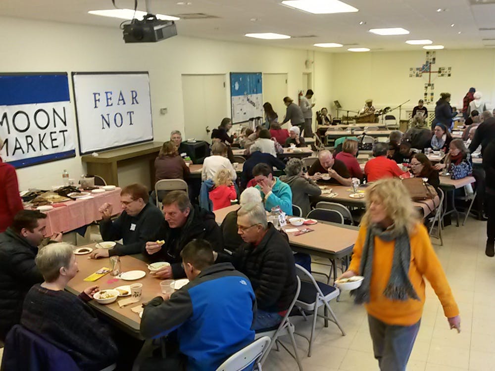 Oxford residents enjoy a chili lunch for MOON Co-op Market, held at Holy Trinity Episcopal Church.