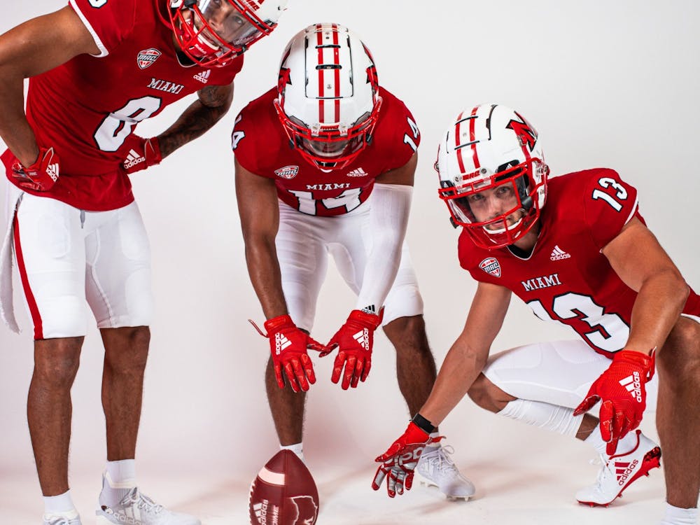 (from left to right) wide receivers Mac Hippenhammer, Jalen Walker and Jack Sorenson pose in Miami's new uniforms.