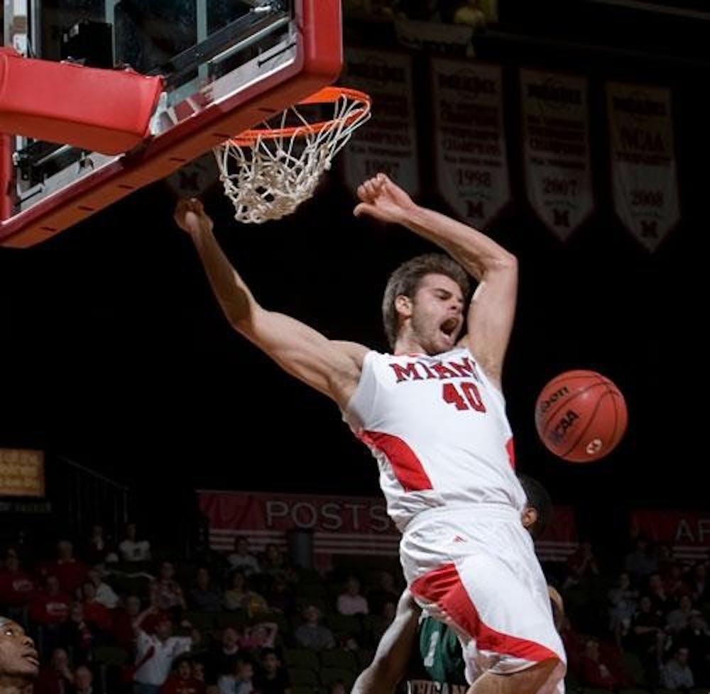 Redshirt senior forward Adam Thomas slams home two of his six points during Miami University’s 62-57 victory over Eastern Michigan University Feb. 1. The RedHawks will look to notch their fourth conference victory Saturday against Central Michigan University at Millett Hall.