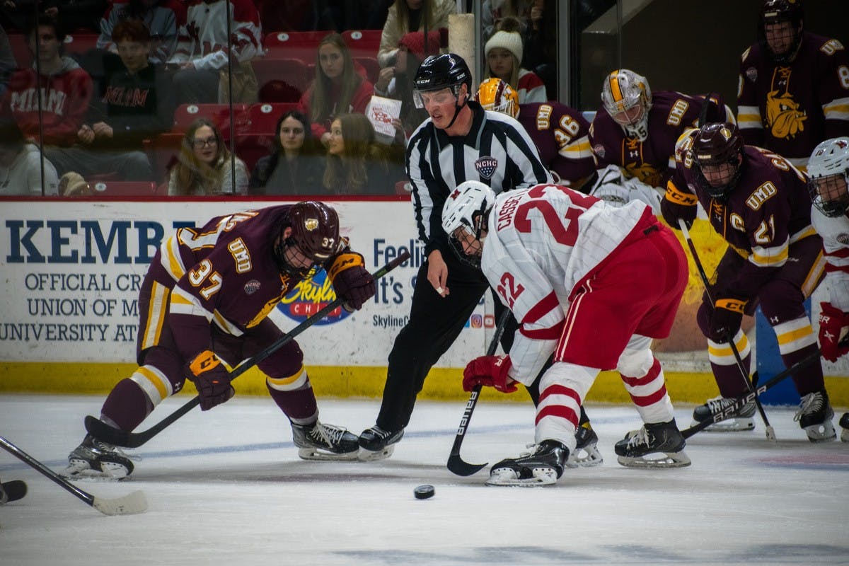 Senior forward Joe Cassetti wins a faceoff against a Minnesota-Duluth player last year.