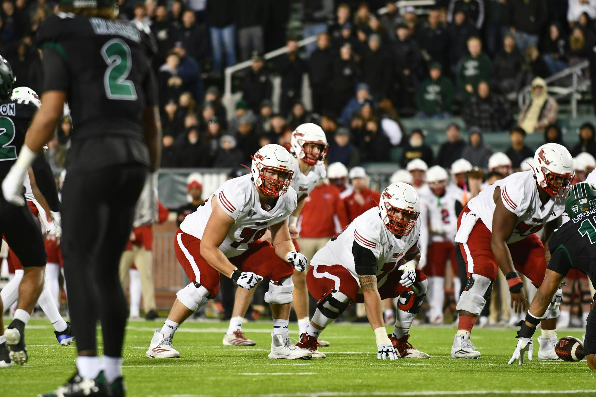 Miami's offensive line prepares for a snap in the second quarter at Peden Stadium on Nov. 4